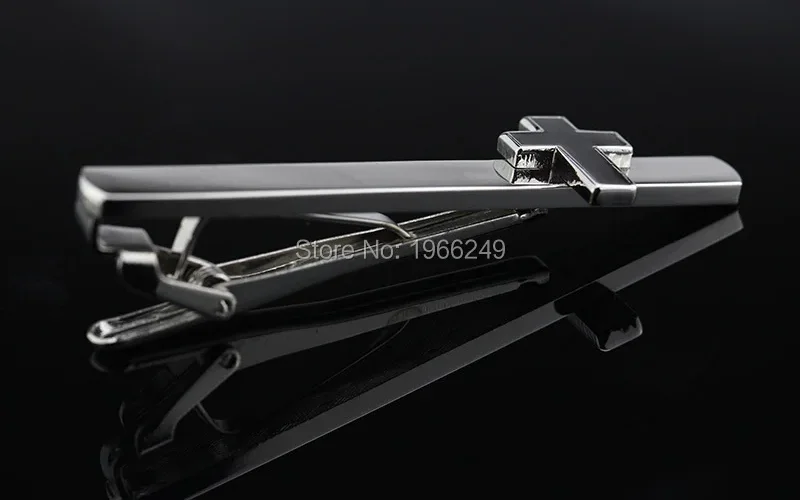 Extreme close-up of the hollow flower cut-out, showing the sharp contrast between gold and silver on the round face with light passing through the centre